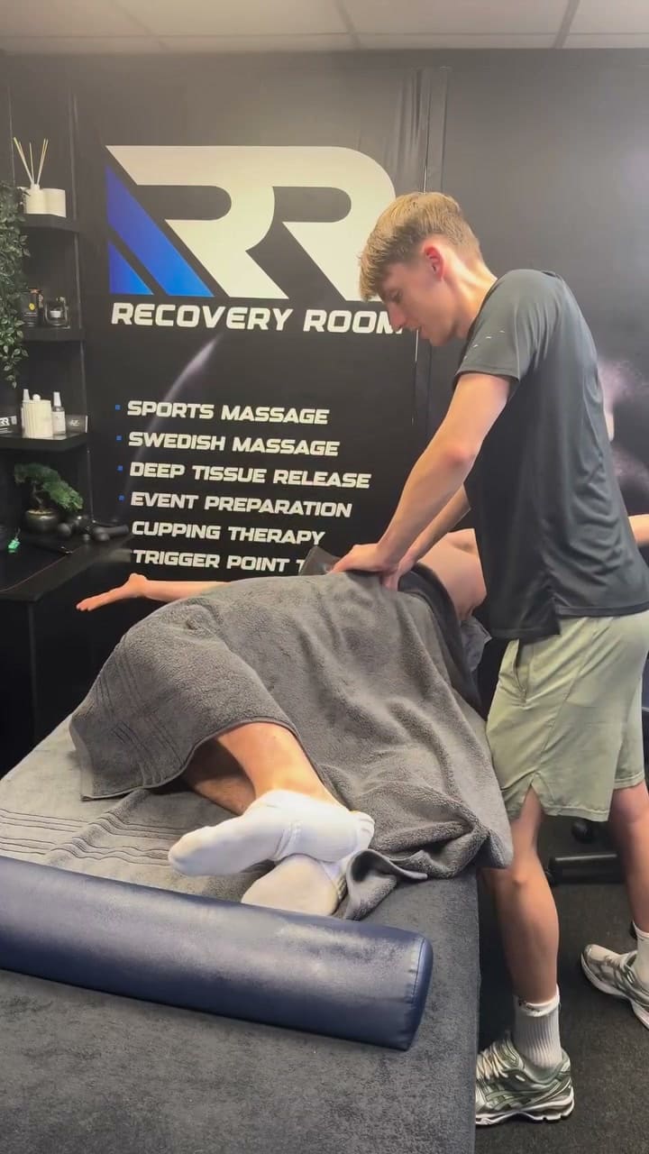 Ben working on a client's hip in the Recovery Room treatment room